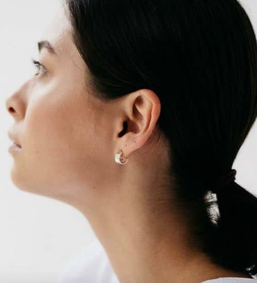 Woman wearing hoop earrings