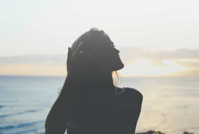 Woman with long hair beside the sea