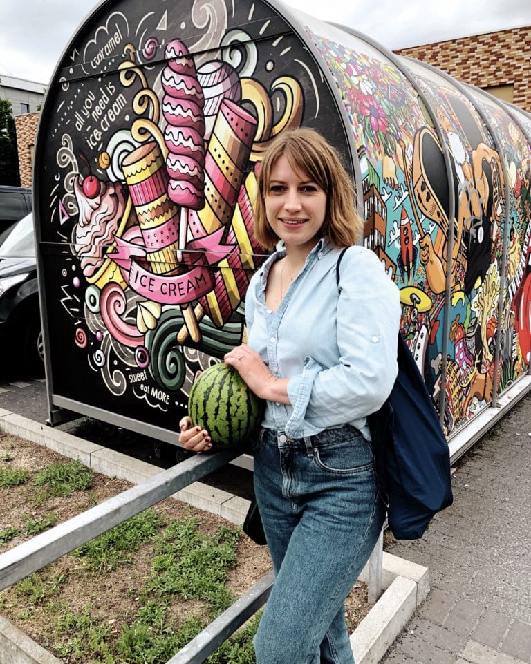 A week of outfits - the green edition carrying a watermelon in a borrowed shirt.