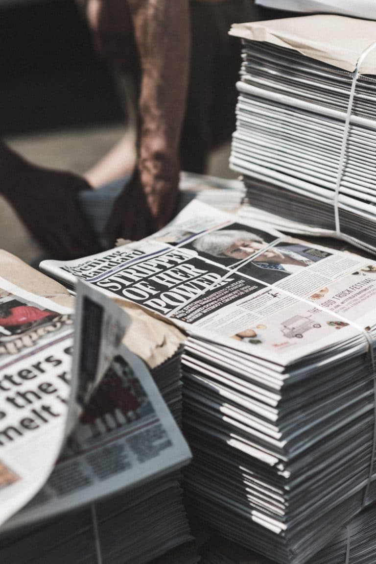 Pile of newspapers in London - sustainable fashion links