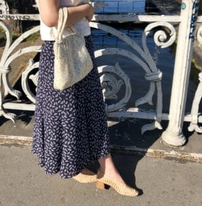 Laura wearing a secondhand linen top and blue skirt.