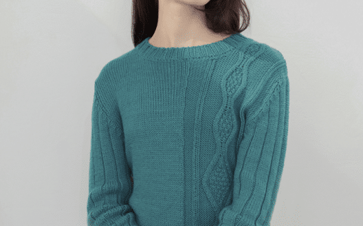 Woman in a Maqu sweater