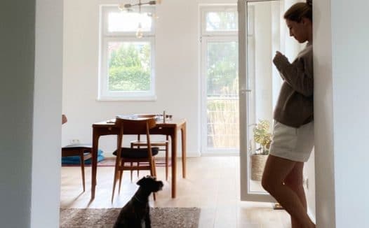 Woman at home with dog